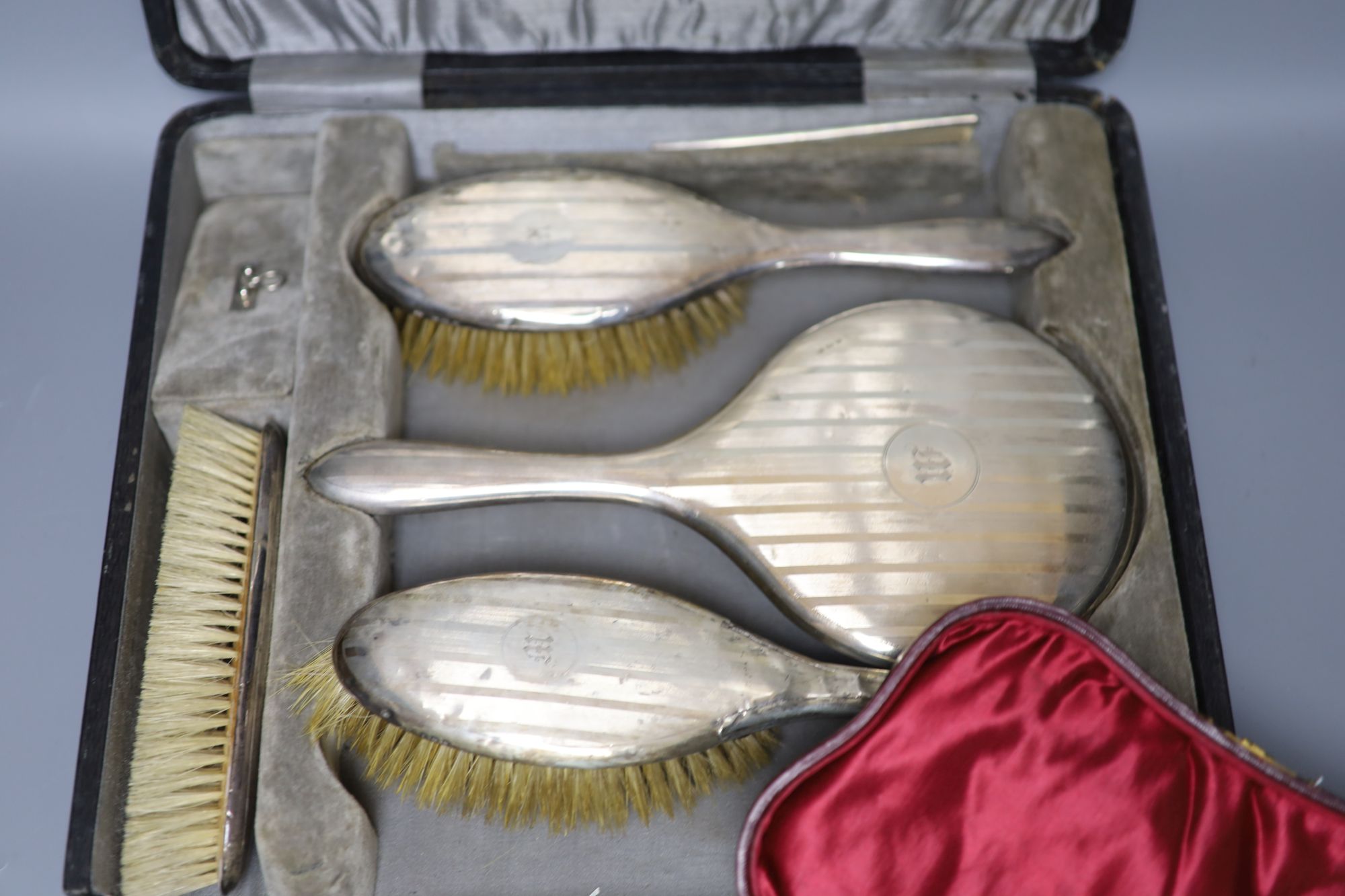 Two cased silver dressing table sets